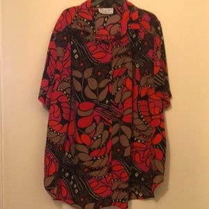 Multicoloured plus size button front blouse with back yoke.